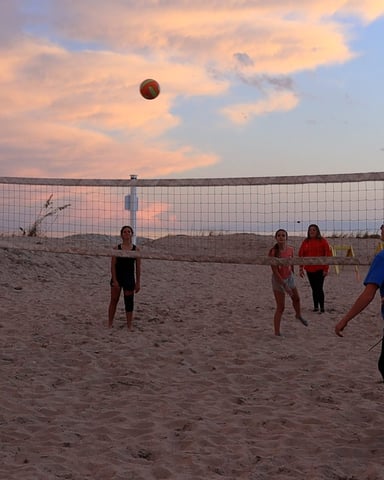 Beach volleyball at sunset on the Ocean Lakes oceanfront